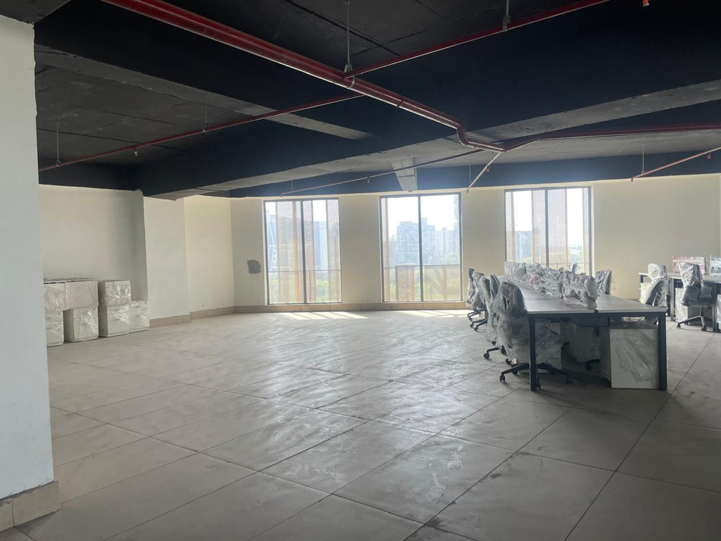 Office floor with natural light — ~7875 sq ft per floor, corporate leasing Sector 136